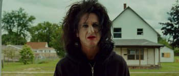 Movie still from “This Must Be the Place” (2011), directed by Paolo Sorrentino – A woman with black hair wearing a black hoodie; Close Up shot, Low angle