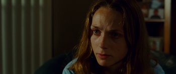 Movie still from “This Must Be the Place” (2011), directed by Paolo Sorrentino – A person with long brown hair; Close Up shot, Over the shoulder angle