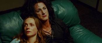Movie still from “This Must Be the Place” (2011), directed by Paolo Sorrentino – A woman and a young girl sitting next to each other on a couch; Close Up shot, Low angle