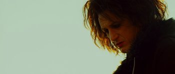 Movie still from “This Must Be the Place” (2011), directed by Paolo Sorrentino – A person with long hair; Close Up shot, Low angle