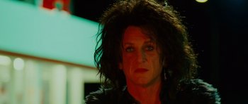 Movie still from “This Must Be the Place” (2011), directed by Paolo Sorrentino – A person wearing a black shirt; Close Up shot, Low angle