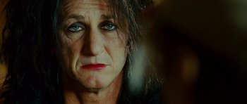 Movie still from “This Must Be the Place” (2011), directed by Paolo Sorrentino – An older woman with blue eyes looking at the camera; Close Up shot, Over the shoulder angle