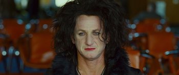 Movie still from “This Must Be the Place” (2011), directed by Paolo Sorrentino – A person wearing a black jacket; Close Up shot, Low angle