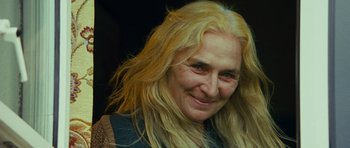 Movie still from “This Must Be the Place” (2011), directed by Paolo Sorrentino – A person with long blonde hair; Close Up shot, Over the shoulder angle