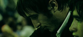 Movie still from “Three Monkeys” (2008), directed by Nuri Bilge Ceylan – A man's face in the dark; Close Up shot, Low angle