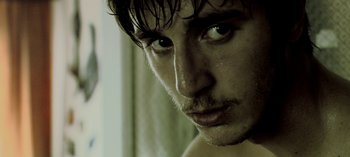 Movie still from “Three Monkeys” (2008), directed by Nuri Bilge Ceylan – A man's face with wet hair; Extreme Close Up shot, Low angle