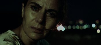 Movie still from “Three Monkeys” (2008), directed by Nuri Bilge Ceylan – A woman's face at night; Close Up shot, Low angle