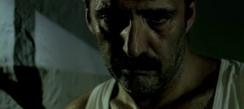 Movie still from “Three Monkeys” (2008), directed by Nuri Bilge Ceylan – A person with a beard; Close Up shot, Low angle