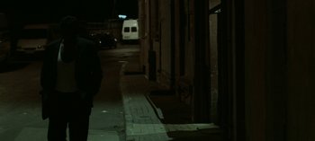 Movie still from “Three Monkeys” (2008), directed by Nuri Bilge Ceylan – A van parked on the side of the road at night; Wide shot, Over the shoulder angle