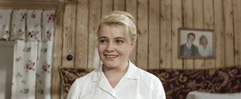 Movie still from “Three Poplars on Plyuschikha Street” (1968), directed by Tatyana Lioznova – A woman in white shirt smiling for the camera; Close Up shot, Low angle