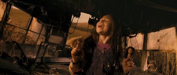 Movie still from “Tideland” (2005), directed by Terry Gilliam – A young girl holding a stuffed animal in her hands; Close Up shot, Low angle