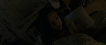 Movie still from “Tideland” (2005), directed by Terry Gilliam – A little girl is looking up at the camera; Close Up shot, High angle