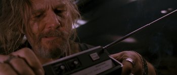 Movie still from “Tideland” (2005), directed by Terry Gilliam – A person holding a remote control; Close Up shot, Low angle