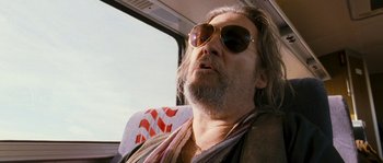 Movie still from “Tideland” (2005), directed by Terry Gilliam – A person wearing sunglasses on a bus; Close Up shot, Low angle