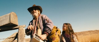 Movie still from “Tideland” (2005), directed by Terry Gilliam – A man and a little girl walking in the desert; Medium shot, Low angle