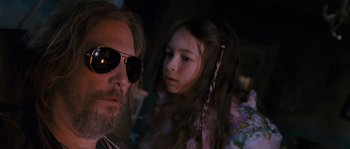 Movie still from “Tideland” (2005), directed by Terry Gilliam – A man and a little girl are looking at the camera; Close Up shot, Over the shoulder angle