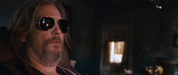 Movie still from “Tideland” (2005), directed by Terry Gilliam – A person wearing sunglasses; Close Up shot, Low angle
