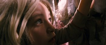Movie still from “Tideland” (2005), directed by Terry Gilliam – A young woman is looking out a window; Close Up shot, Low angle