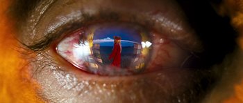 Movie still from “Tideland” (2005), directed by Terry Gilliam – A person's eye with the reflection of a man in it; Extreme Close Up shot, Overhead angle