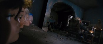 Movie still from “Tideland” (2005), directed by Terry Gilliam – A room that has a creepy doll on the wall in it; Wide shot, High angle