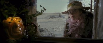 Movie still from “Tideland” (2005), directed by Terry Gilliam – A girl in a hat looking out of a window; Close Up shot, Over the shoulder angle