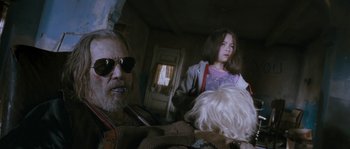 Movie still from “Tideland” (2005), directed by Terry Gilliam – An older man and a young girl in a room; Close Up shot, Low angle