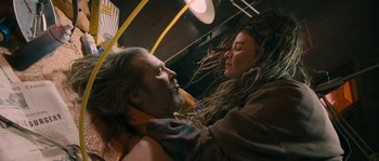 Movie still from “Tideland” (2005), directed by Terry Gilliam – A man and a woman with dreadlocks on a bus; Medium shot, Overhead angle