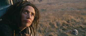 Movie still from “Tideland” (2005), directed by Terry Gilliam – A person with dreadlocks in a field; Close Up shot, Low angle