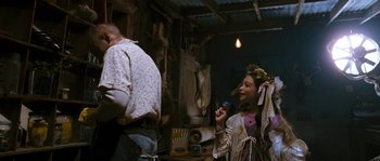 A man and a woman are in a room