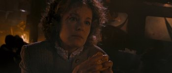 Movie still from “Tideland” (2005), directed by Terry Gilliam – A woman holding a hot dog in her hands; Close Up shot, High angle