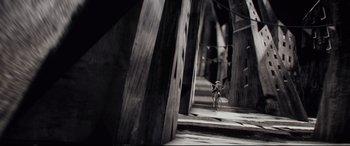 Movie still from “Tigers Are Not Afraid” (2017), directed by Issa López – A bicycle parked on the side of a road; Extreme Wide shot, High angle