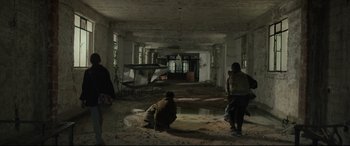Movie still from “Tigers Are Not Afraid” (2017), directed by Issa López – A group of people standing in an abandoned building; Wide shot, High angle