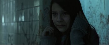 Movie still from “Tigers Are Not Afraid” (2017), directed by Issa López – A young woman is looking into the camera; Close Up shot, High angle