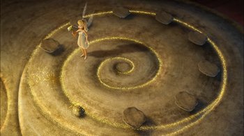 Movie still from “Tinker Bell” (2008), directed by Bradley Raymond – An image of an animated character in a circle of rocks; Extreme Wide shot, Overhead angle