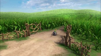 Movie still from “Tinker Bell” (2008), directed by Bradley Raymond – An animal laying on the ground in the grass; Extreme Wide shot, High angle