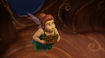 Movie still from “Tinker Bell” (2008), directed by Bradley Raymond – A cartoon of a fairy holding a basket in her hands; Wide shot, High angle