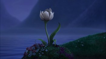 Movie still from “Tinker Bell” (2008), directed by Bradley Raymond – A white flower is growing out of a mound of flowers; Extreme Wide shot, Low angle