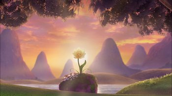 Movie still from “Tinker Bell” (2008), directed by Bradley Raymond – A yellow flower sitting on top of a rock in the middle of a field; Extreme Wide shot, Low angle
