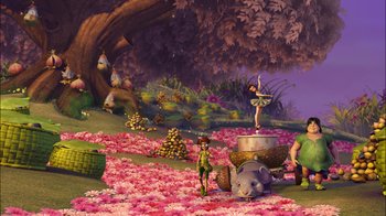 Movie still from “Tinker Bell” (2008), directed by Bradley Raymond – An artistic rendering of a flower garden with a person and an elephant in the background; Extreme Wide shot, Low angle