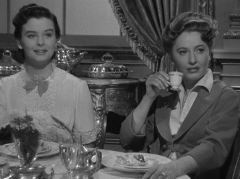 Movie still from “Titanic” (1953), directed by Jean Negulesco – Two women sitting at a table with a cup of tea; Medium shot, Over the shoulder angle
