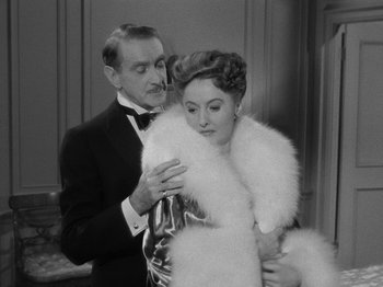 Movie still from “Titanic” (1953), directed by Jean Negulesco – A black and white photo of a man and a woman; Medium shot, High angle