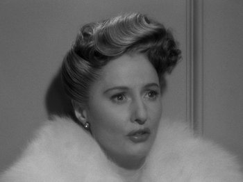 Movie still from “Titanic” (1953), directed by Jean Negulesco – An old photo of a woman in a fur coat; Close Up shot, Over the shoulder angle