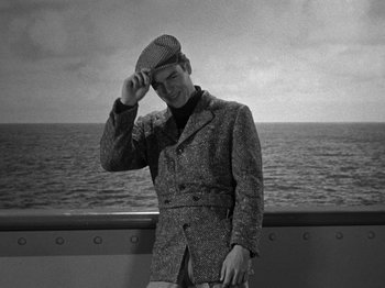 Movie still from “Titanic” (1953), directed by Jean Negulesco – A black and white photo of a man on a boat; Medium shot, High angle