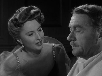 Movie still from “Titanic” (1953), directed by Jean Negulesco – An older man and a younger woman are looking at each other; Close Up shot, Over the shoulder angle