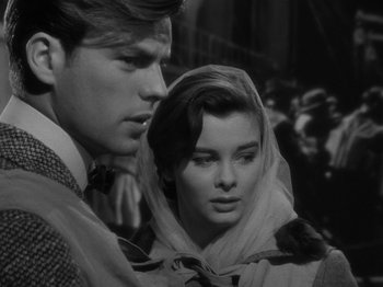 Movie still from “Titanic” (1953), directed by Jean Negulesco – A man and a woman standing next to each other; Close Up shot, Over the shoulder angle