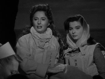 Movie still from “Titanic” (1953), directed by Jean Negulesco – A couple of women standing next to each other; Close Up shot, Low angle