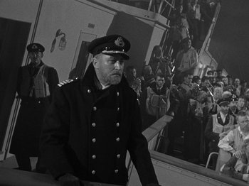 Movie still from “Titanic” (1953), directed by Jean Negulesco – Black and white photograph of a man in a military uniform; Medium shot, Low angle