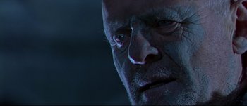 Movie still from “Titus” (1999), directed by Julie Taymor – An old man with a sad look on his face; Close Up shot, Low angle