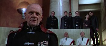 Movie still from “Titus” (1999), directed by Julie Taymor – A group of men standing next to each other in uniform; Close Up shot, Low angle