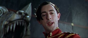 Movie still from “Titus” (1999), directed by Julie Taymor – A person wearing a crown; Close Up shot, Low angle